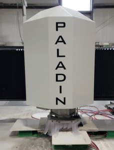 Paladin - Stone Fabricator Solutions White angular industrial unit labeled PALADIN stacked vertically on a platform in a lab or workshop setting